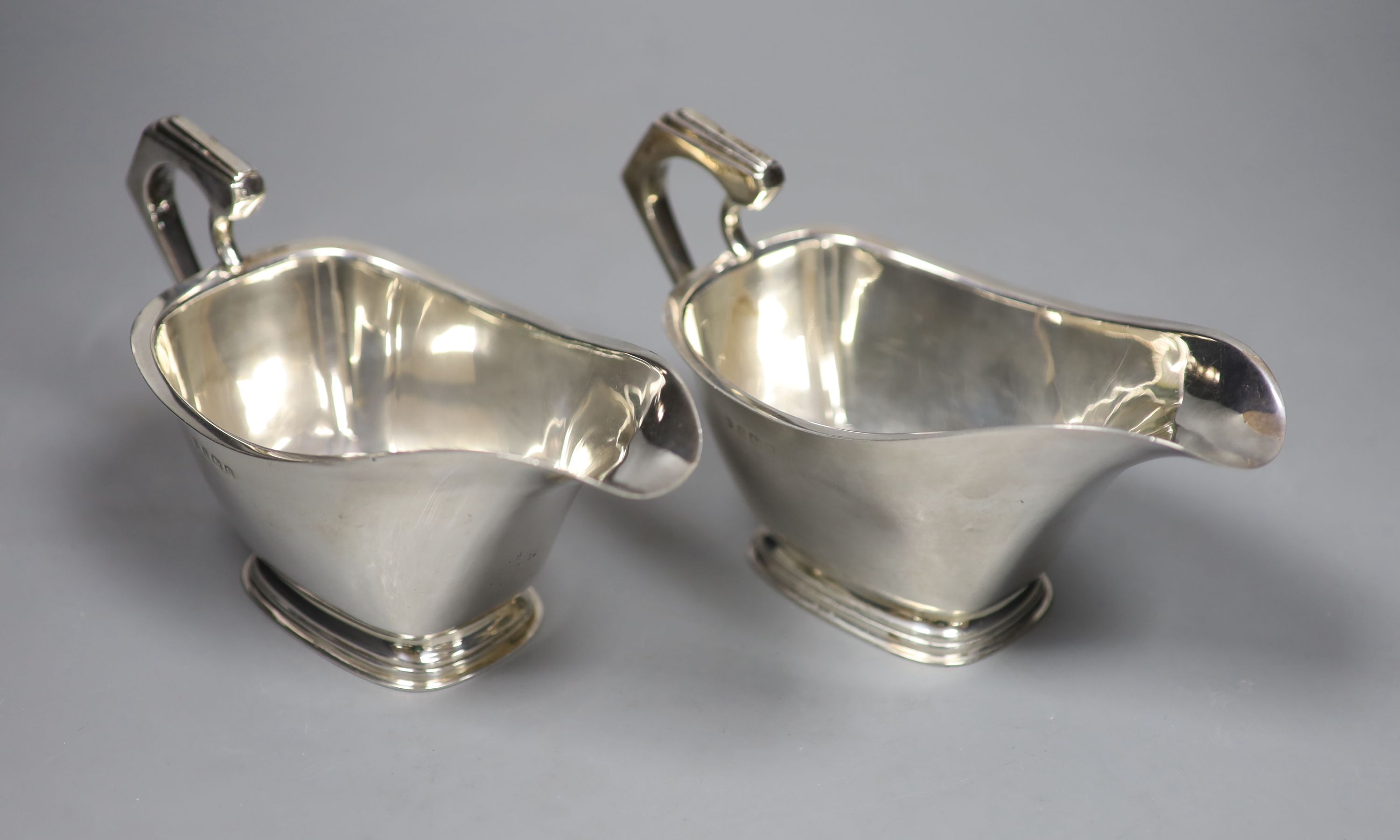 A pair of silver sauce boats, william Neale Ltd, Birmingham, 1935, 12oz.